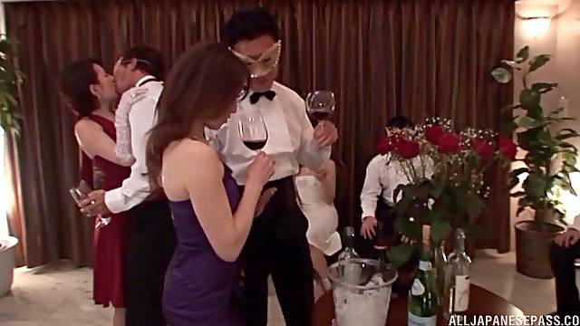 Japanese wife drops on her knees to be fucked during a party