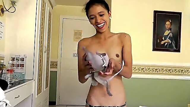 Skinny Asian teen spreads her legs