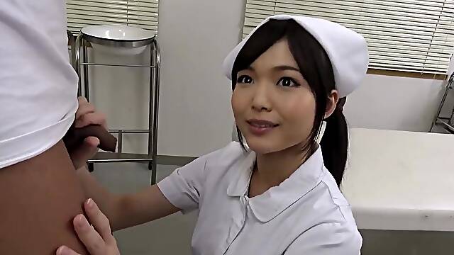An Oriental nurse provides assistance to a patient in achieving cumshot by enthusiastically performing oral-job stimulation on his