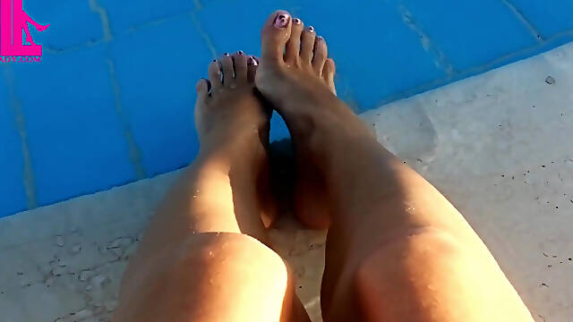Barefoot Dangling in Swimming Pool Water